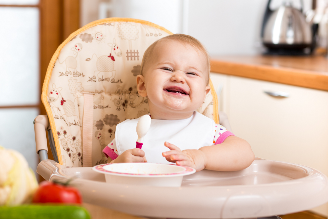 Funny baby eating kitchen