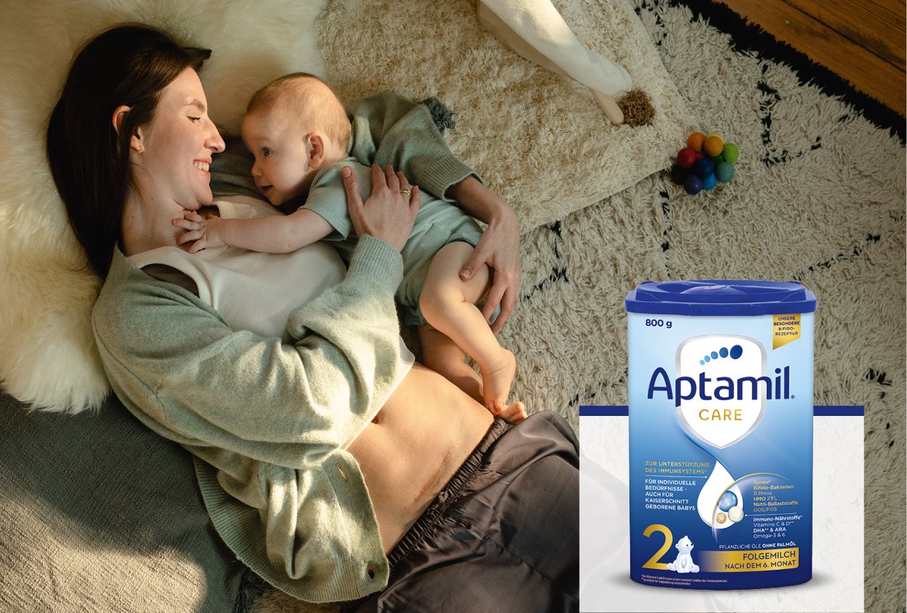 Mutter mit Baby im Arm 