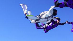sky divers creating circle - left focus