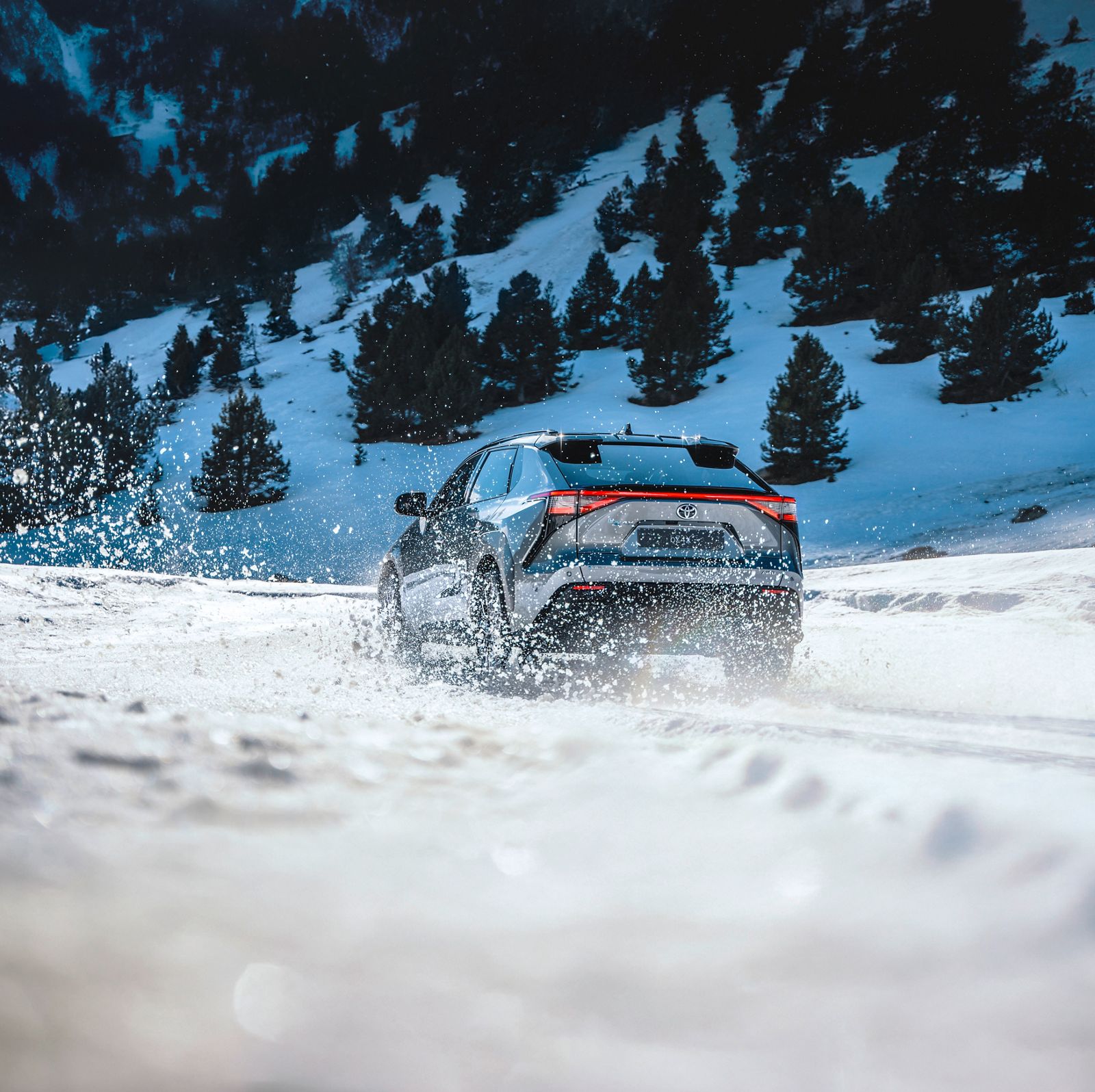 A Toyota bZ4X on a snowy track