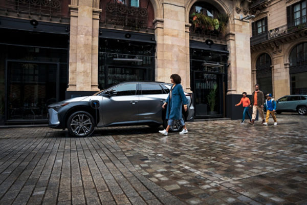 Toyota bZ4X charging on city road